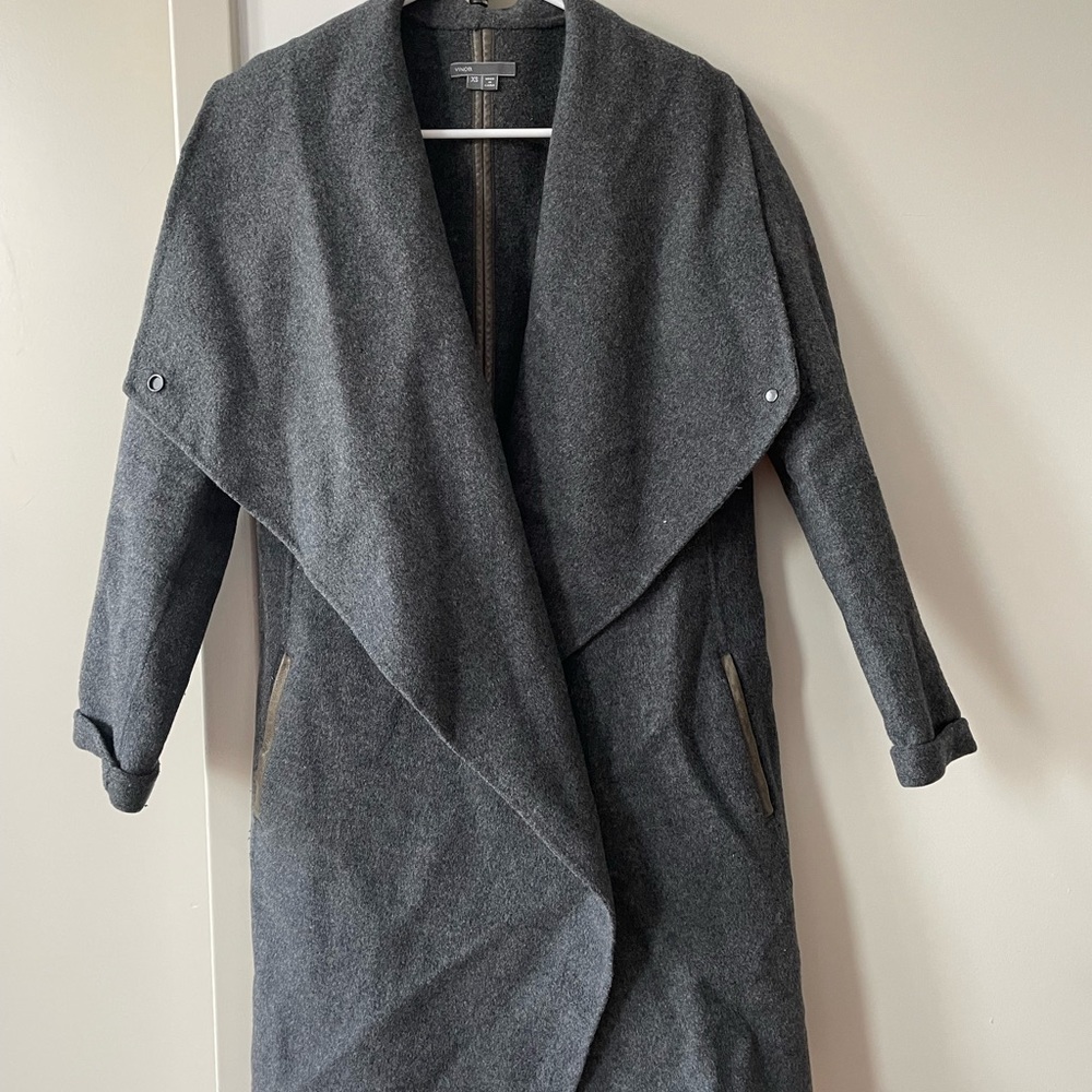 Grey long Vince coat buttons on the side.